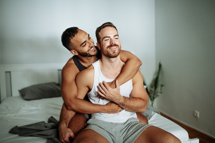 Handsome men at home, LGBT couple enjoying their marriage