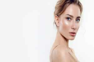 Woman with dewy, youthful skin after facial treatment in Austin, TX